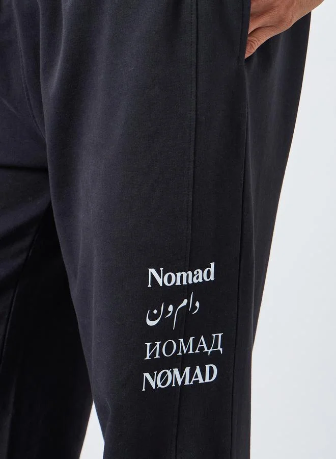 Styli Men Black Slogan Print Relaxed Joggers